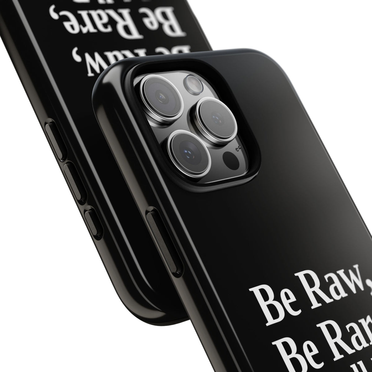 No ShopCo Be Raw tough phone case: glossy black case with white serif lettering reading Be Raw, Be Rare, Be Well Done above a small divider, close-up of the raised camera cutout on a triple-camera iPhone