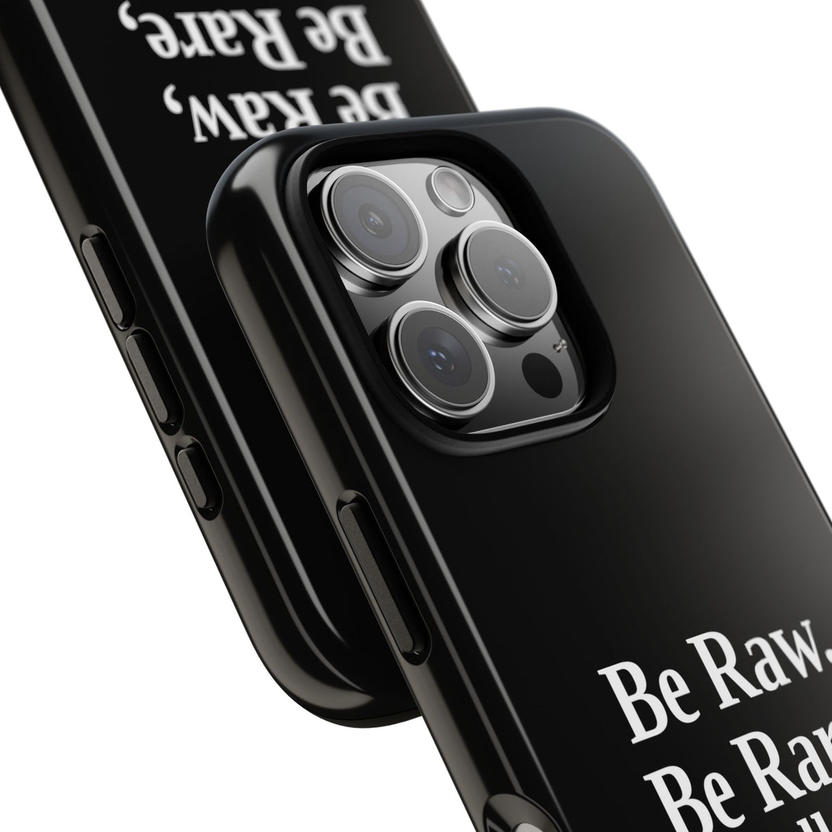 No ShopCo Be Raw tough phone case: glossy black case with white serif lettering reading Be Raw, Be Rare, Be Well Done above a small divider, close-up of the raised camera cutout on a triple-camera iPhone