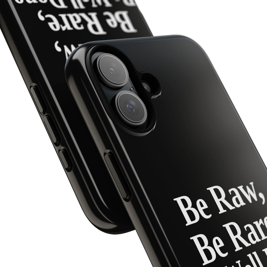 No ShopCo Be Raw tough phone case: glossy black case with white serif lettering reading Be Raw, Be Rare, Be Well Done above a small divider, close-up of the raised camera cutout on a dual-camera iPhone