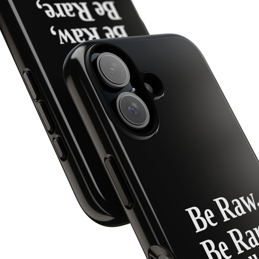 No ShopCo Be Raw tough phone case: glossy black case with white serif lettering reading Be Raw, Be Rare, Be Well Done above a small divider, close-up of the raised camera cutout on a dual-camera iPhone
